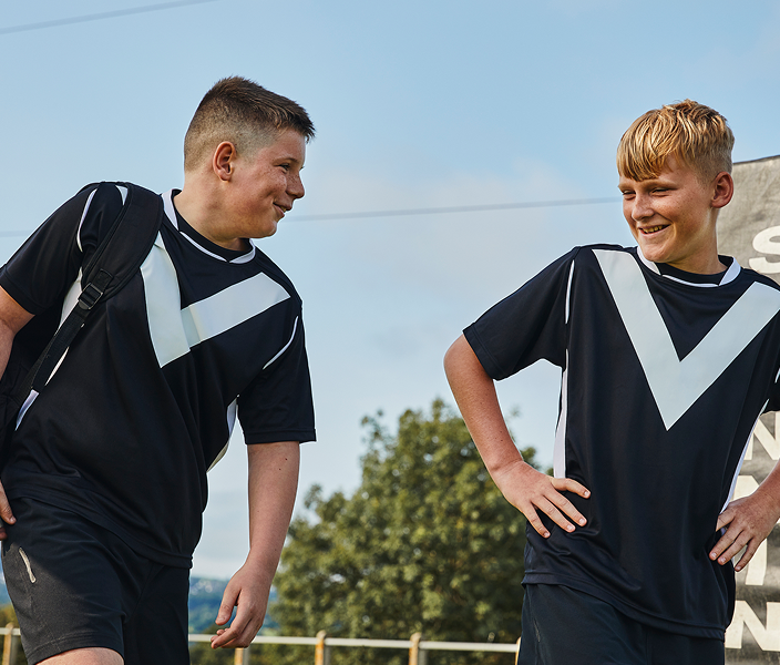 Two young rugby athletes talking